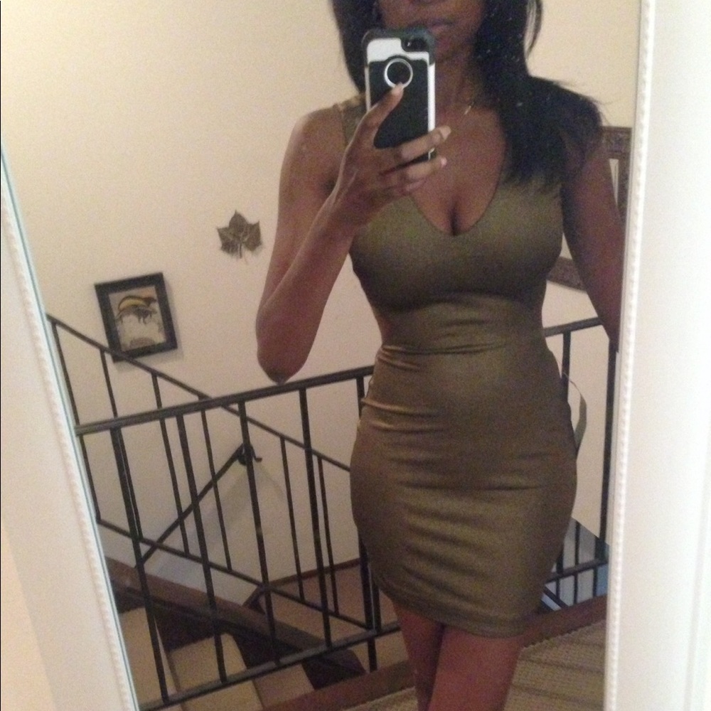 NWT Metallic Gold dress by Bebe in a size Small